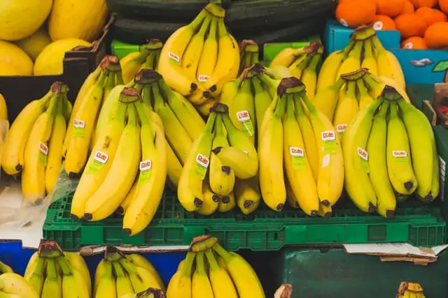 You need to remove the labels from the banana skins before composting.