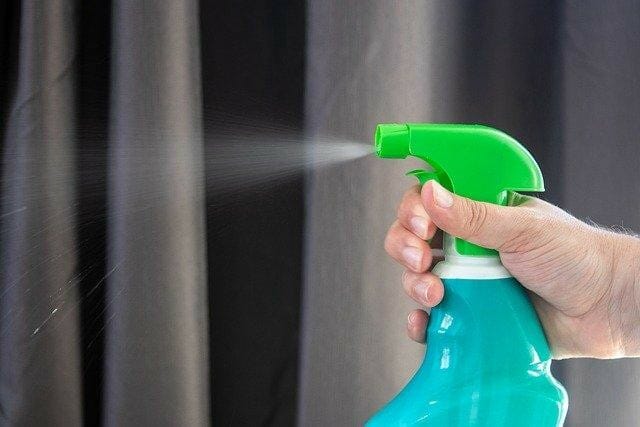 hand sprayer spraying insecticide